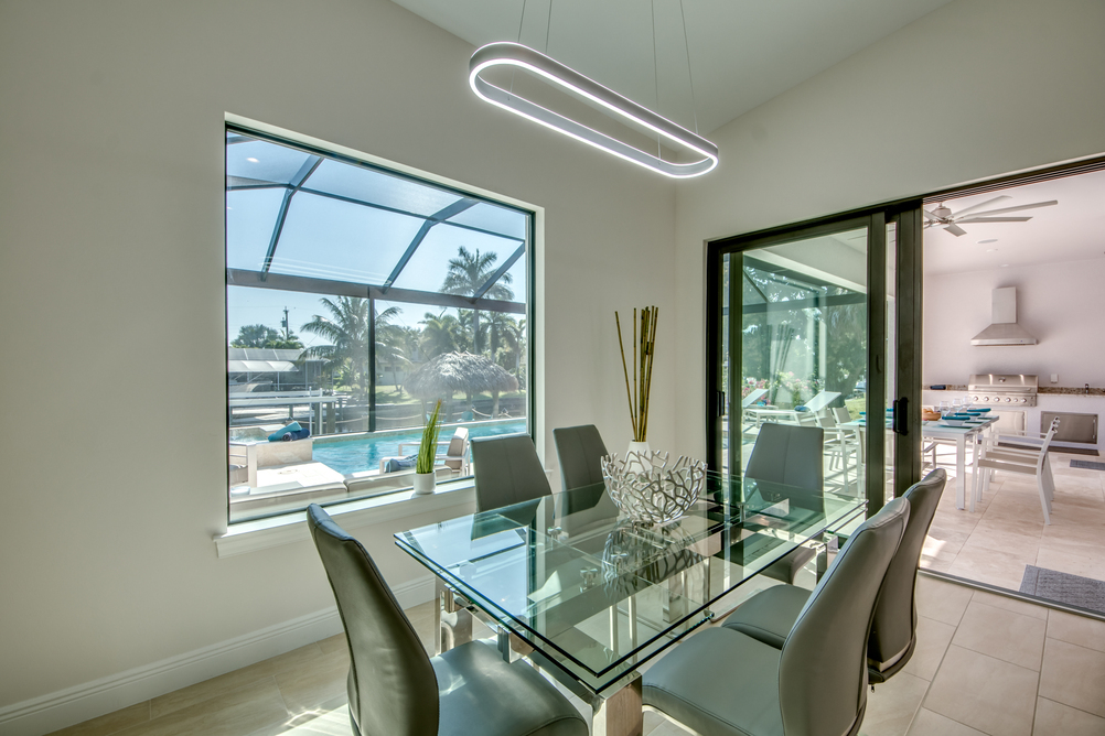 Dining area with a glass table in Villa Aesthetic