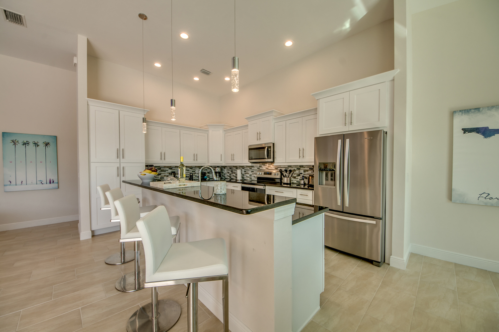 Kitchen with a bar area in Villa Aesthetic