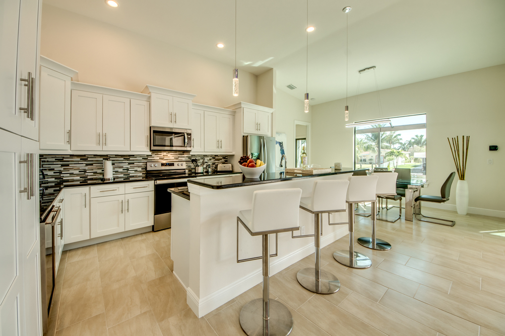 Kitchen with bar stool in Villa Aesthetic