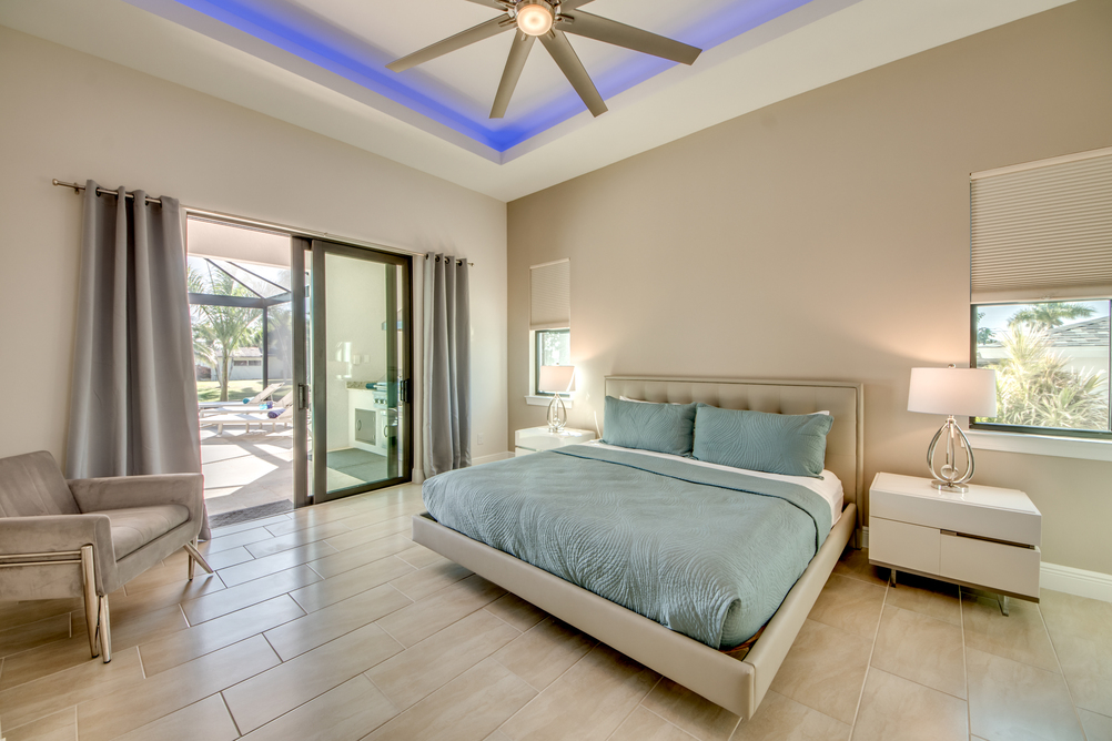 Bedroom with white furniture in Villa Aesthetic