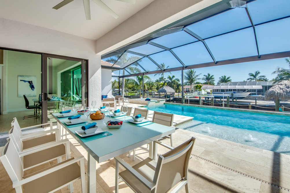 Dining table in front of the pool in Villa Aesthetic