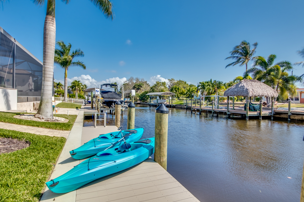Two blue kayaks on the pole of Villa Aesthetic